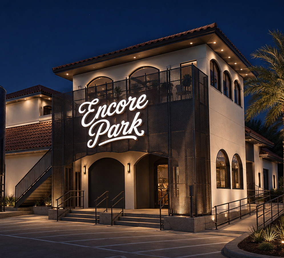 Nighttime exterior of Encore Park with the illuminated Encore Park sign